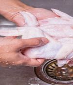 Why You Should Never Wash Raw Chicken In Your Kitchen